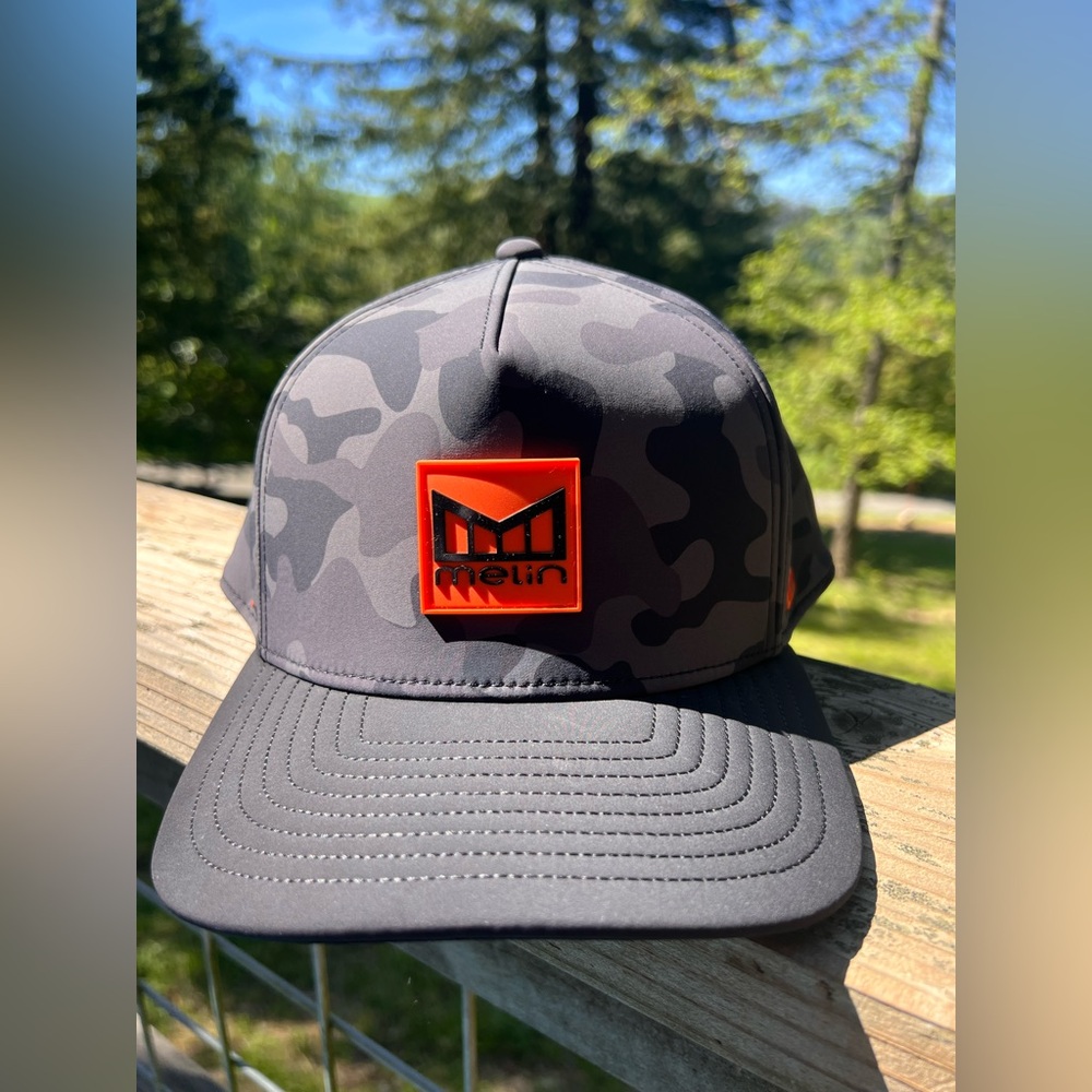 Melin Camouflage Hat with Orange Logo